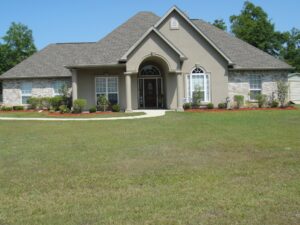 front view of a house with trees at the back
