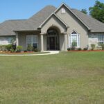 front view of the house with a lawn