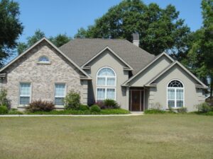 Suburban ranch-style home with arched windows