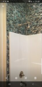 screenshot of a picture of a shower area corner