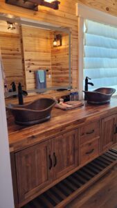two bathroom sinks with a mirror