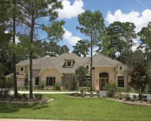Sprawling stucco and brick home among pines