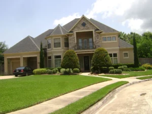 Large two-story suburban house with manicured lawn